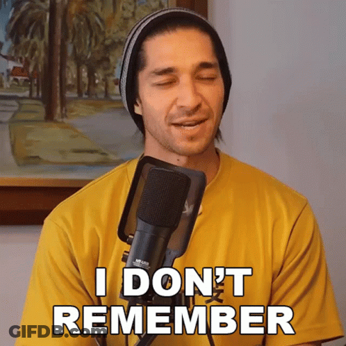 A Man Singing Into A Microphone With The Words " I Don 'T Remember " Written On His Shirt GIF