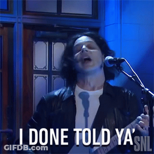 A Man Singing Into A Microphone With The Words I Done Told Ya ' Snl Behind Him GIF