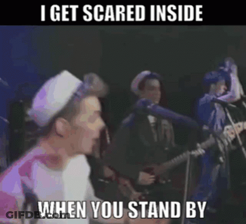 A Man Singing Into A Microphone With The Words I Get Scared Inside When You Stand By Below Him GIF