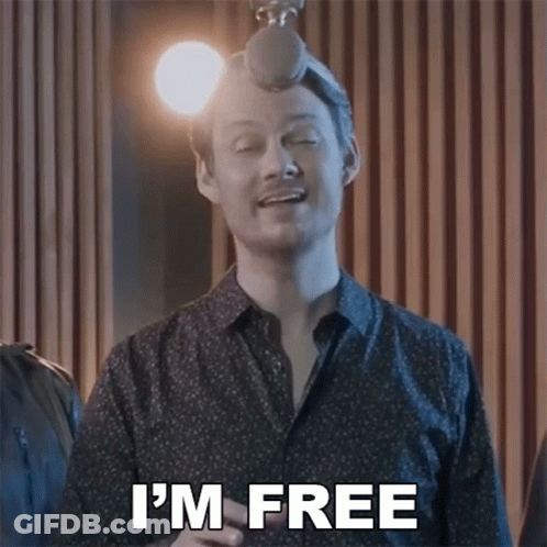 A Man Singing Into A Microphone With The Words I 'M Free Above Him GIF