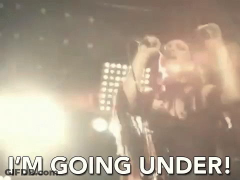 A Man Singing Into A Microphone With The Words " I 'M Going Under " Written Below Him . GIF