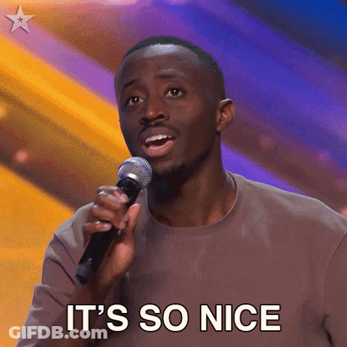A Man Singing Into A Microphone With The Words It 'S So Nice Written Below Him GIF
