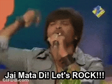A Man Singing Into A Microphone With The Words " Jai Mata Dil Let 'S Rock !!! " Below Him GIF