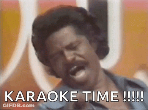 A Man Singing Into A Microphone With The Words " Karaoke Time !!! " Written Below Him GIF