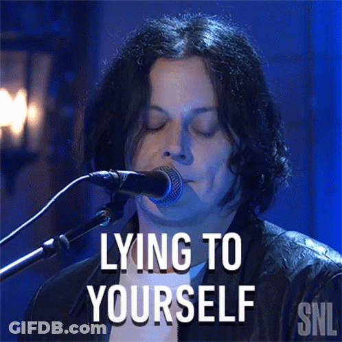 A Man Singing Into A Microphone With The Words Lying To Yourself On The Bottom GIF