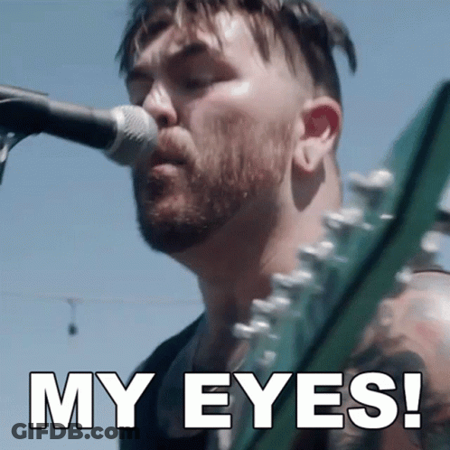 A Man Singing Into A Microphone With The Words " My Eyes " Above Him GIF
