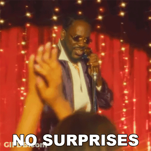 A Man Singing Into A Microphone With The Words " No Surprises " Above Him GIF