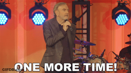A Man Singing Into A Microphone With The Words " One More Time " Below Him GIF