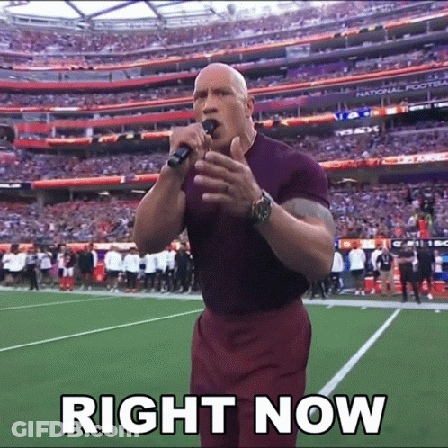 A Man Singing Into A Microphone With The Words Right Now Written Below Him GIF