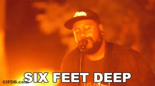 A Man Singing Into A Microphone With The Words Six Feet Deep Written Below Him GIF