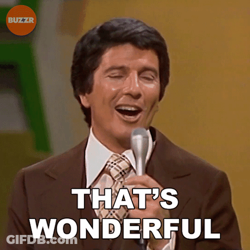 A Man Singing Into A Microphone With The Words That 'S Wonderful Above Him GIF