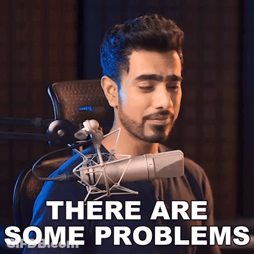 A Man Singing Into A Microphone With The Words " There Are Some Problems " Behind Him GIF