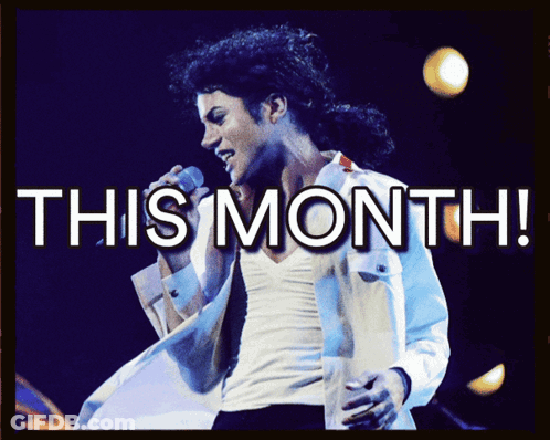 A Man Singing Into A Microphone With The Words This Month GIF