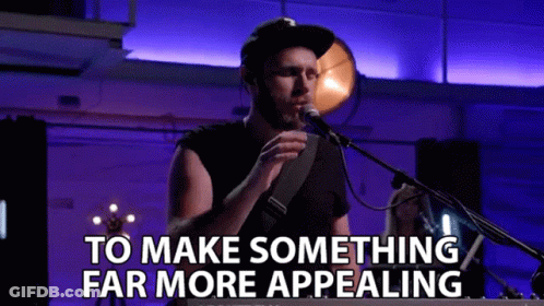 Man Singing Into Microphone With Make Something Far More Appealing Text GIF