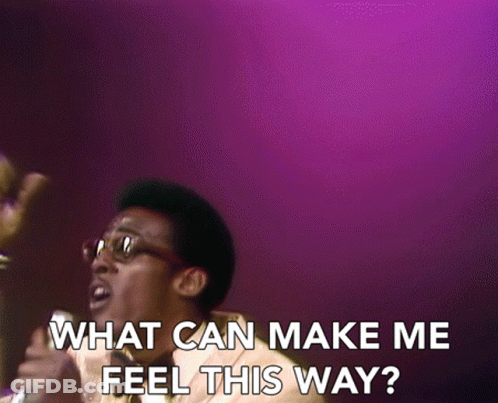 A Man Singing Into A Microphone With The Words " What Can Make Me Feel This Way " On The Bottom GIF