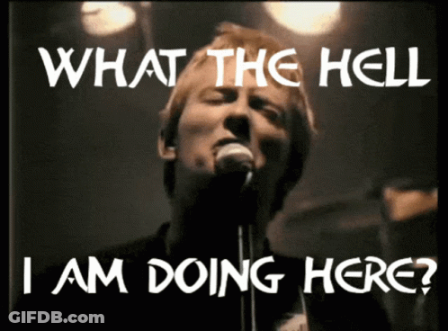A Man Singing Into A Microphone With The Words " What The Hell I Am Doing Here " Above Him GIF
