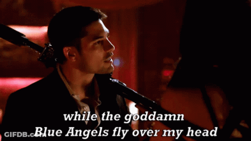 A Man Singing Into A Microphone With The Words While The Goddamn Blue Angels Fly Over My Head GIF