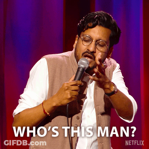 A Man Singing Into A Microphone With The Words Who 'S This Man On The Bottom GIF