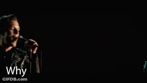 A Man Singing Into A Microphone With The Words Why You Wanna Fight It On The Bottom GIF