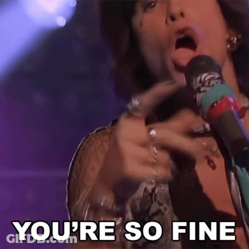 A Man Singing Into A Microphone With The Words " You 'Re So Fine " Behind Him GIF