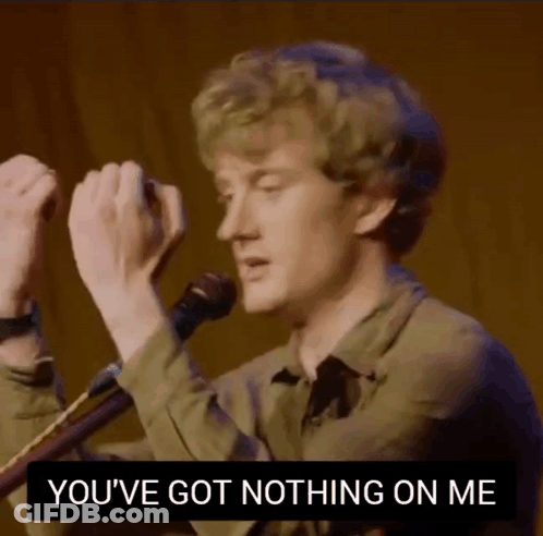 A Man Singing Into A Microphone With The Words " You 'Ve Got Nothing On Me " Above Him GIF
