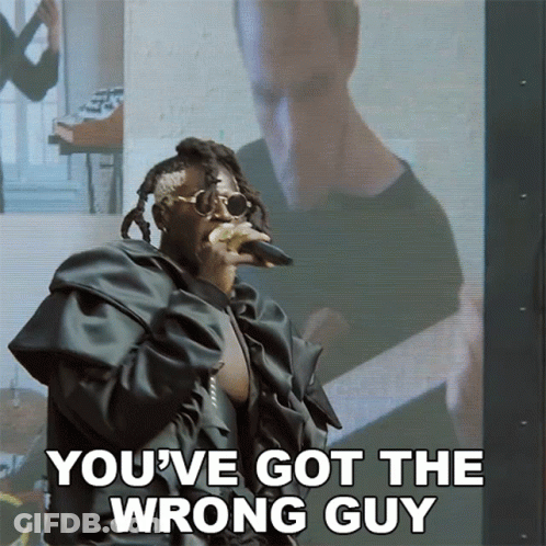 A Man Singing Into A Microphone With The Words " You 'Ve Got The Wrong Guy " Below Him GIF
