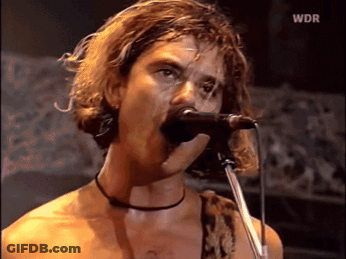 A Man Singing Into A Microphone With Wdr On The Bottom GIF