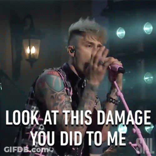 A Man Singing Into A Pink Microphone With The Words Look At This Damage You Did To Me Below Him GIF