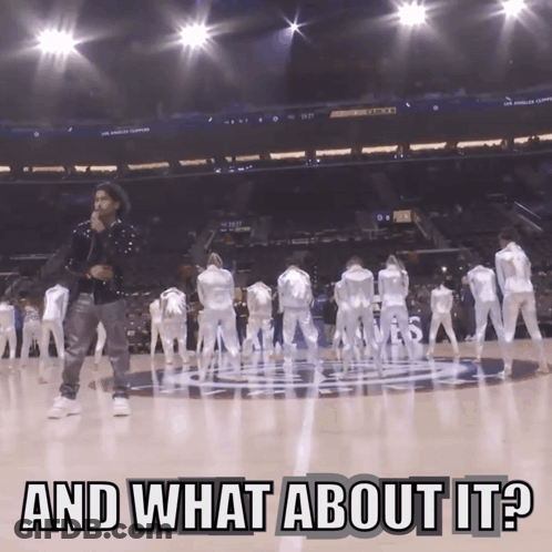 A Man Singing On A Basketball Court With The Words And What About It GIF
