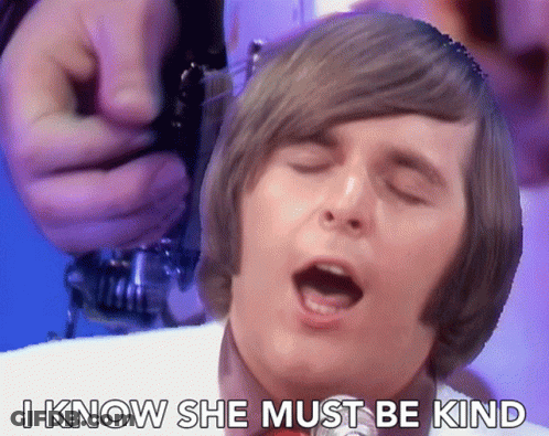A Man Singing With The Words " I Know She Must Be Kind " Above Him GIF