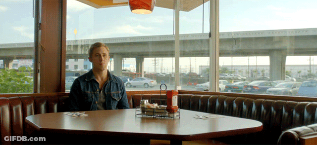 A Man Sits At A Diner Table With A Ketchup Bottle On It GIF