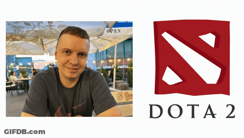 A Man Sits At A Table Next To A Logo For The Video Game Dota 2 GIF