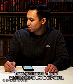A Man Sits At A Table With A Cell Phone And Says There You Have It GIF