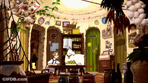 A Man Sits At A Table With A Goat On It GIF