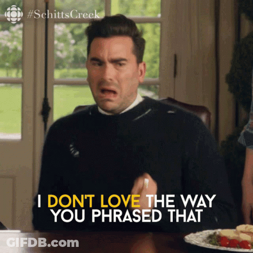 A Man Sits At A Table With A Plate Of Food And Says " I Don T Love The Way You Phrased That " GIF