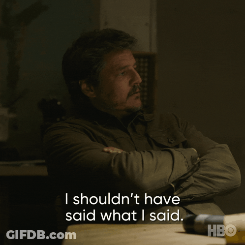 A Man Sits At A Table With His Arms Crossed And Says I Shouldn T Have Said What I Said GIF