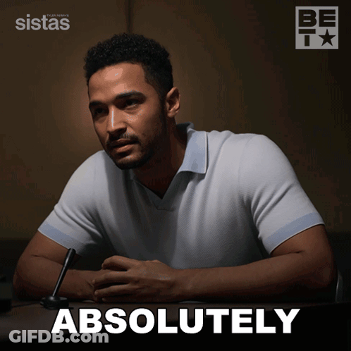 A Man Sits At A Table With The Word Absolutely Written On The Bottom GIF