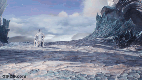 A Man Sits In A Chair In The Middle Of A Snowy Landscape GIF