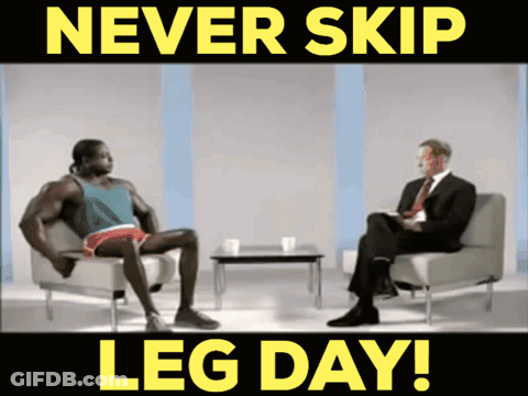 A Man Sits In A Chair Talking To Another Man With The Words Never Skip Leg Day GIF