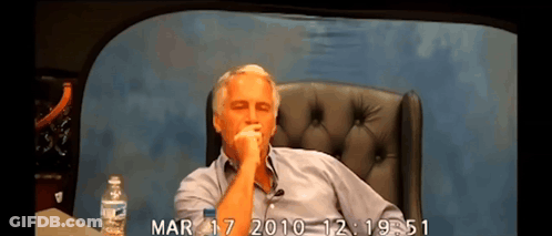 A Man Sits In A Chair With A Bottle Of Water And The Date Mar 17 2010 GIF