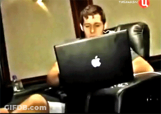A Man Sits In A Chair With An Apple Laptop GIF