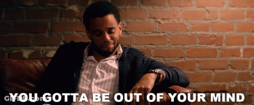 A Man Sits In A Chair With The Words You Gotta Be Out Of Your Mind Written Below Him GIF