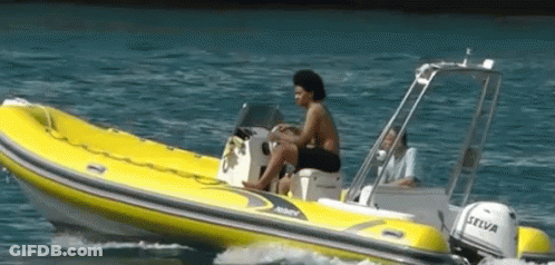 A Man Sits In A Yellow Boat With A Honda Motor GIF
