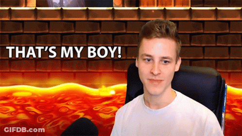 A Man Sits In Front Of A Brick Wall With The Words That 'S My Boy GIF