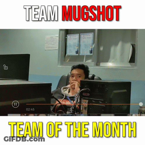 A Man Sits In Front Of A Computer Screen With The Words Team Mugshot Team Of The Month GIF
