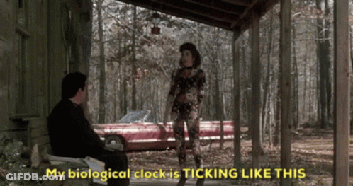 A Man Sits On A Porch Next To A Woman Who Says " My Biological Clock Is Ticking Like This " . GIF