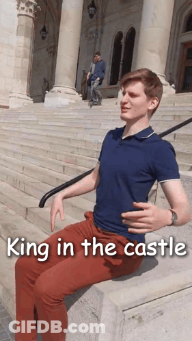 A Man Sits On A Set Of Stairs With The Words King In The Castle Written Below Him GIF
