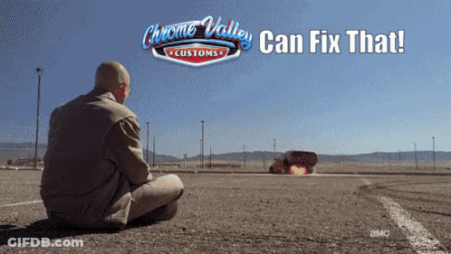 A Man Sits On The Ground In Front Of A Chrome Valley Customs Sign GIF