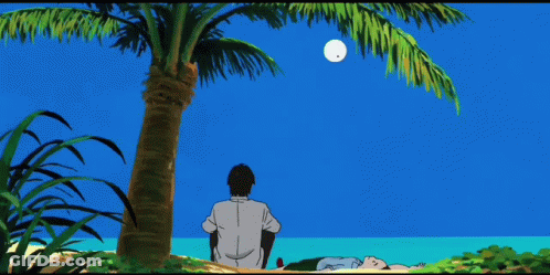 A Man Sits Under A Palm Tree While A Woman Lies On The Beach GIF