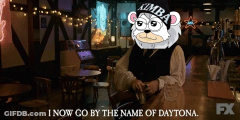A Man Sitting At A Bar With A Kimba Bear On His Head Says I Now Go By The Name Of Daytona GIF